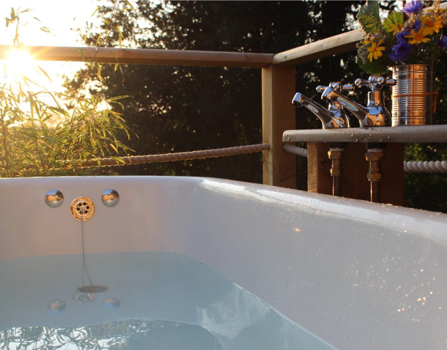 enjoying the sunset in an outdoor bath in Devon