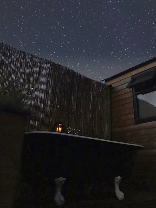 stargazing cabin with outdoor bath at night